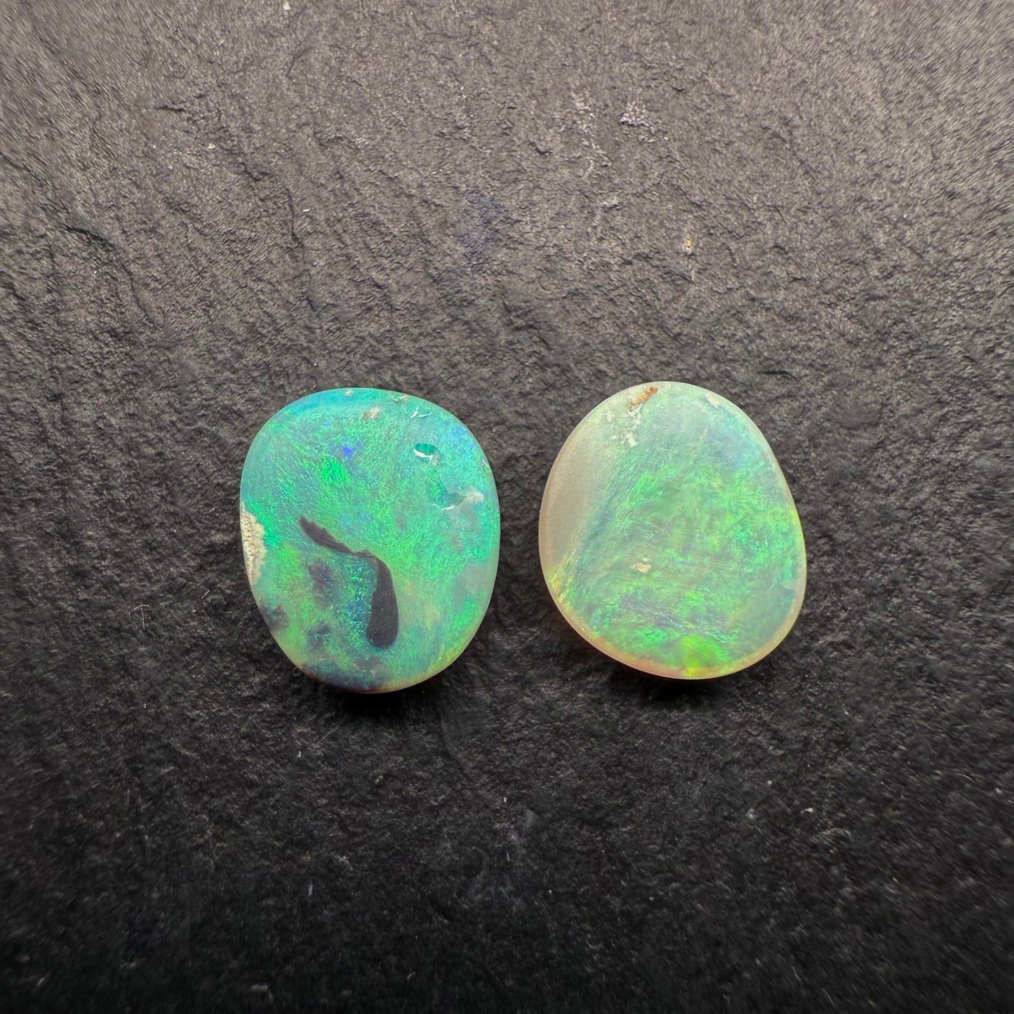 A Mismatched Pair Of Dark Opals With Moss patterns And A Minty Green Color Palette