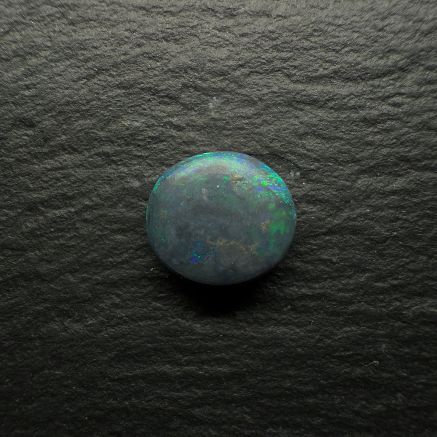 2.44ct Gem Black Opal With A Bright Green-Gold color Palette And A Moss Pattern