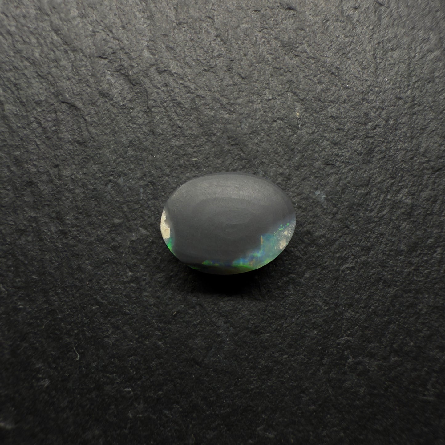 1.6ct Gem Black Opal With A Lovely Green-Gold Color palette With Hints OF Teal And A Mixed Patterns