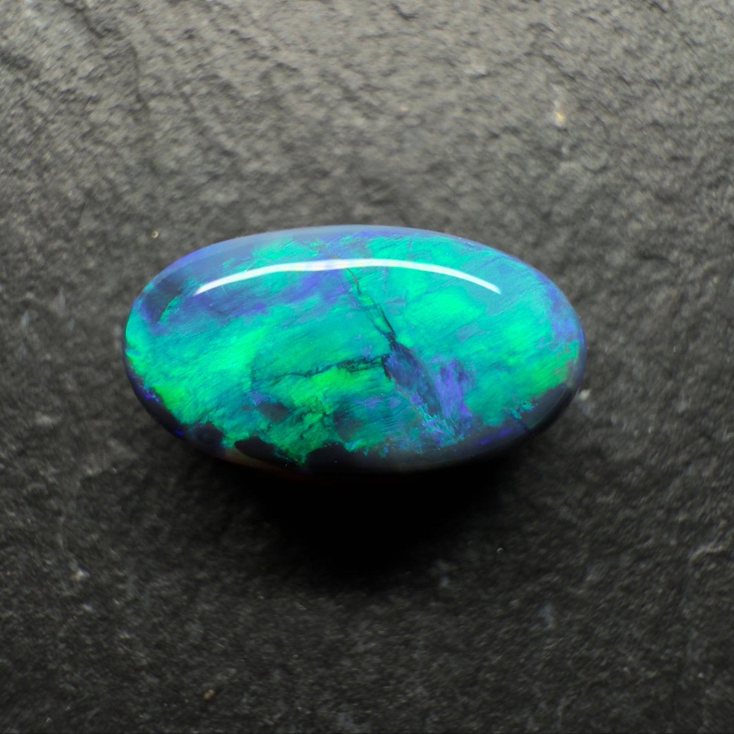1.85ct Gem Black Opal With A Vivid Green-Blue Wispy Broadflash Pattern