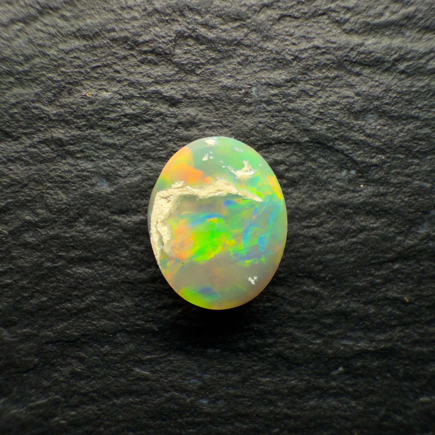 0.72ct Dark Opal With A Brilliant Green-Orange Broadflash Pattern
