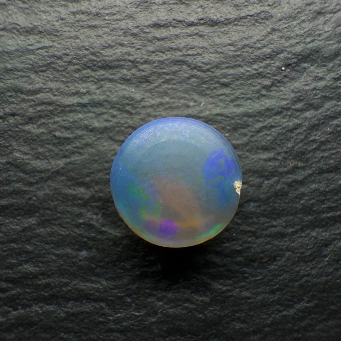 2.2ct Black Crystal Opal. This Gem Has A world Class Cats Eye Pattern And A Rare Teal-Purple Color Palette