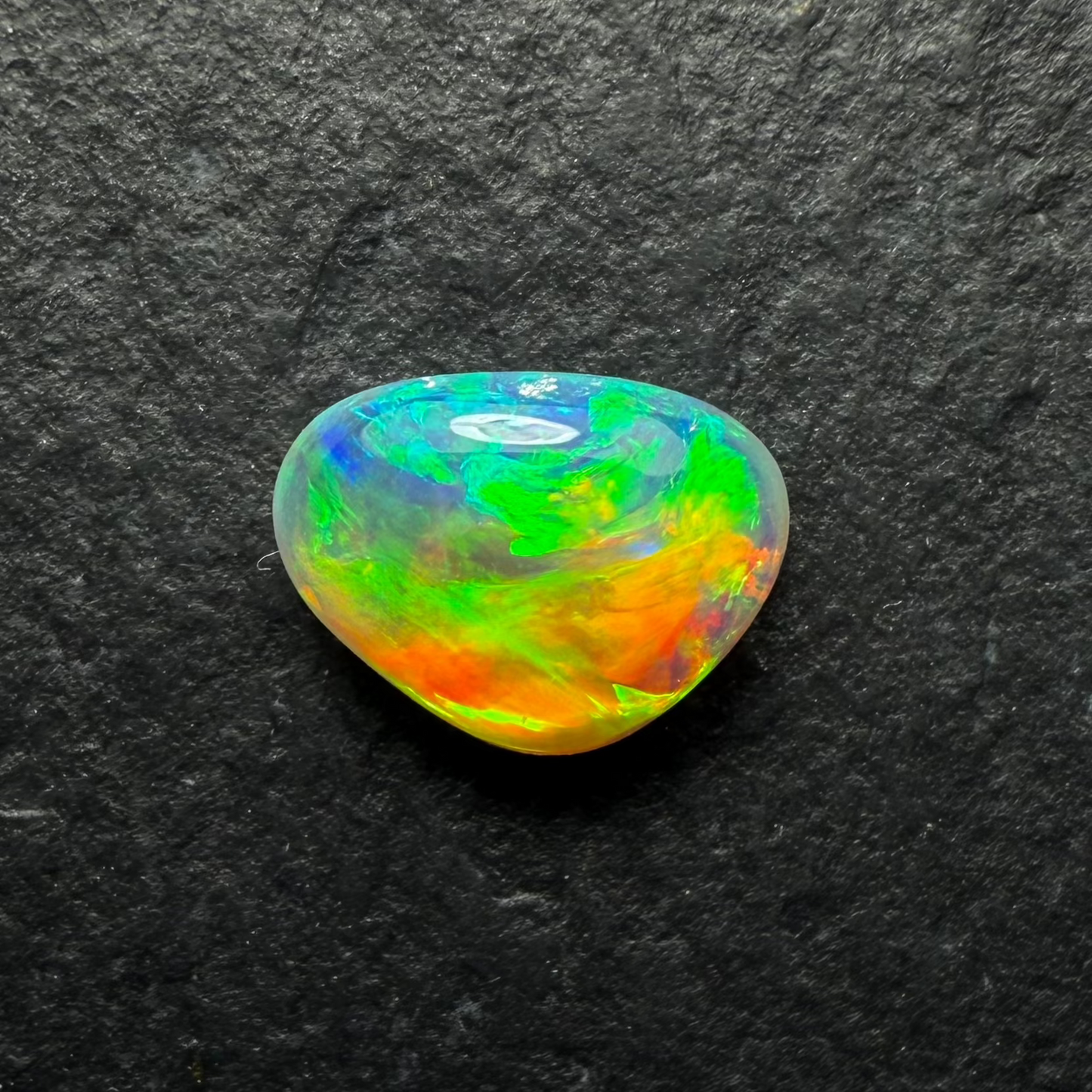 0.58ct World Class Crystal Opal, This Gem Has A Brilliant Orange To Green Color Transition Across The stone.