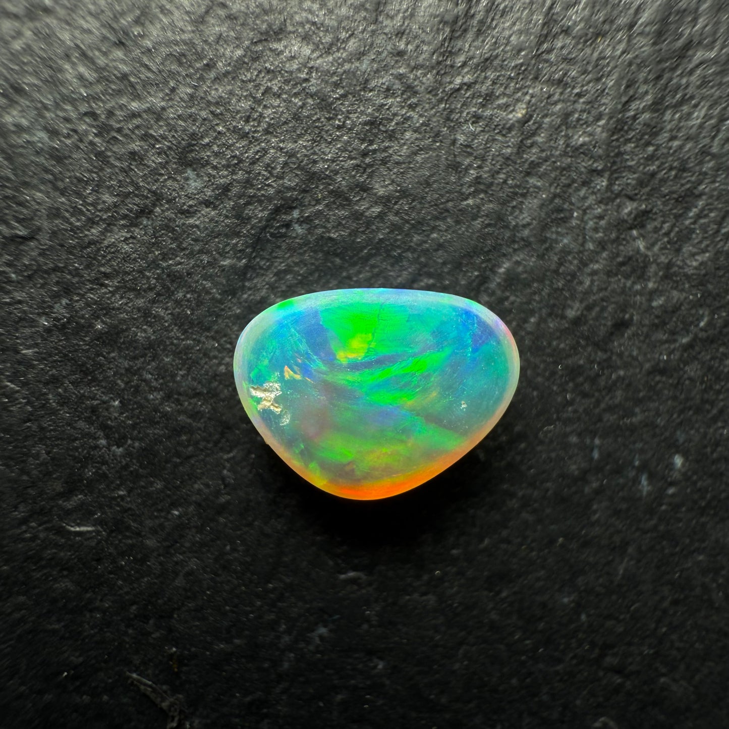 0.58ct World Class Crystal Opal, This Gem Has A Brilliant Orange To Green Color Transition Across The stone.