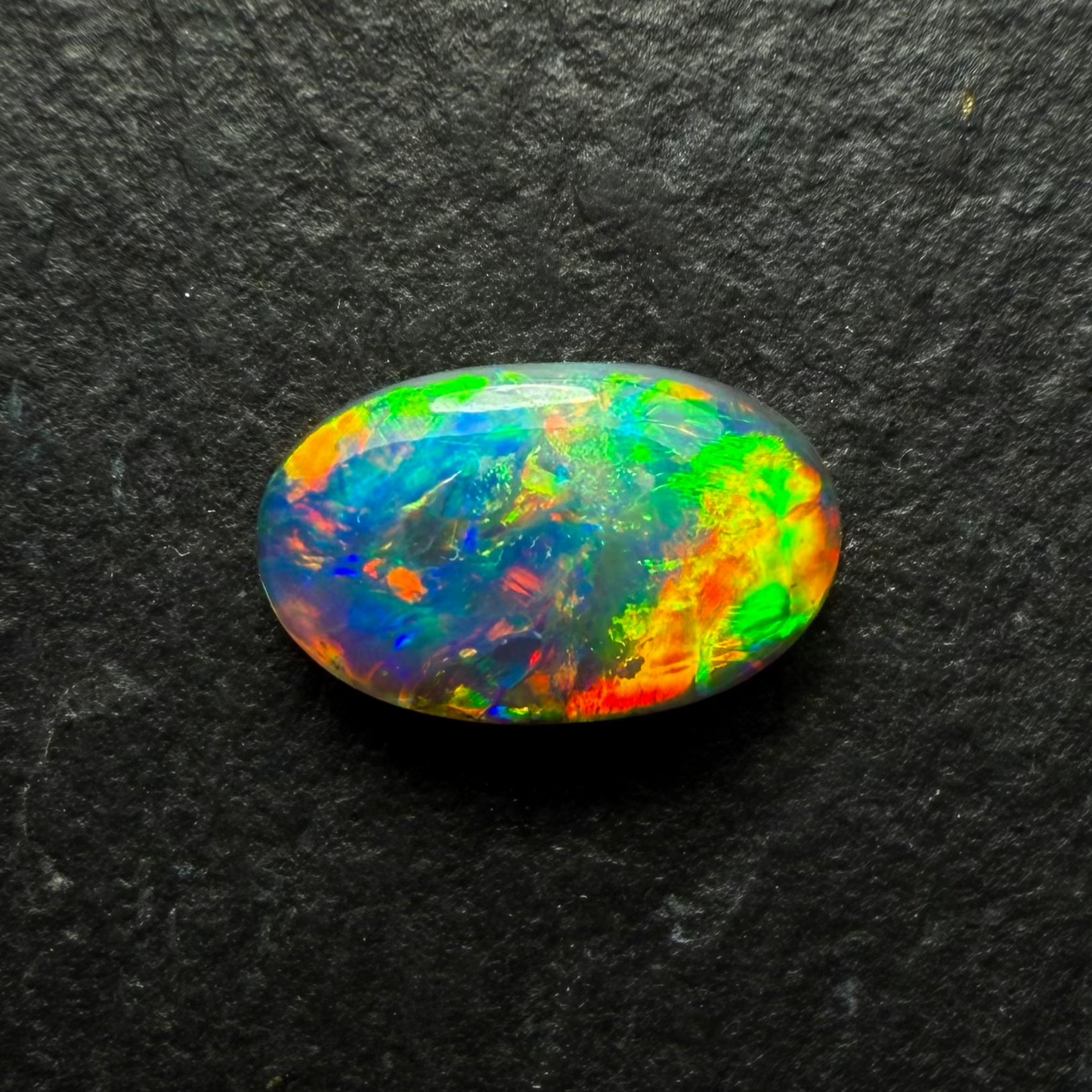 0.6ct Gem Black Opal With A Brilliant Multi Color Palette And Mixed Patterns