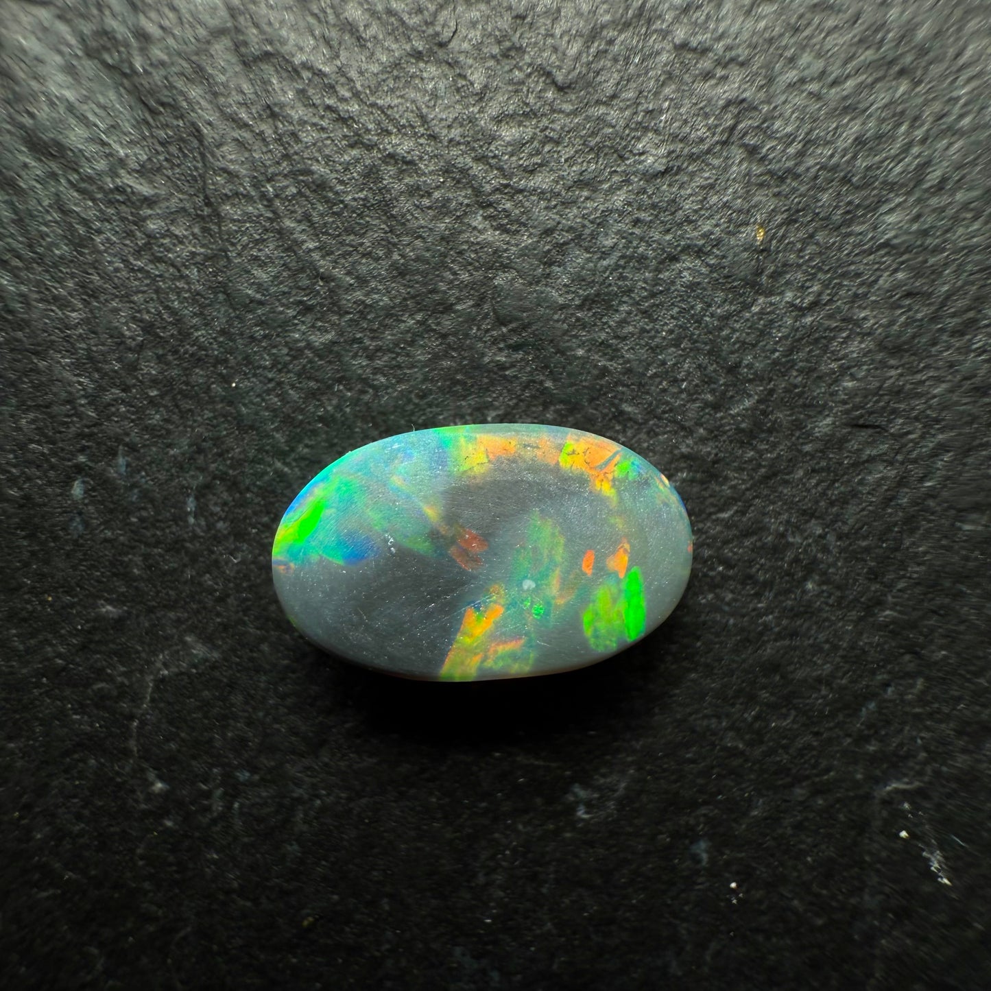 0.6ct Gem Black Opal With A Brilliant Multi Color Palette And Mixed Patterns