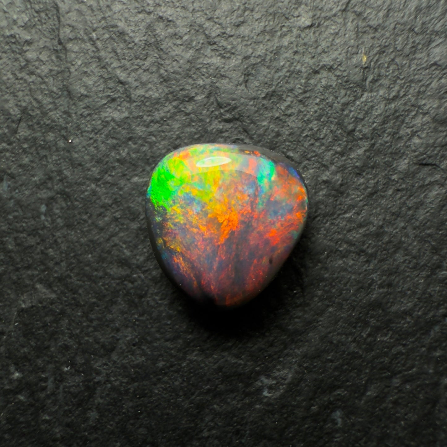 0.64ct Gem Black Opal With A Lovely Red Multi-Color Palette And Small Flash Pattern
