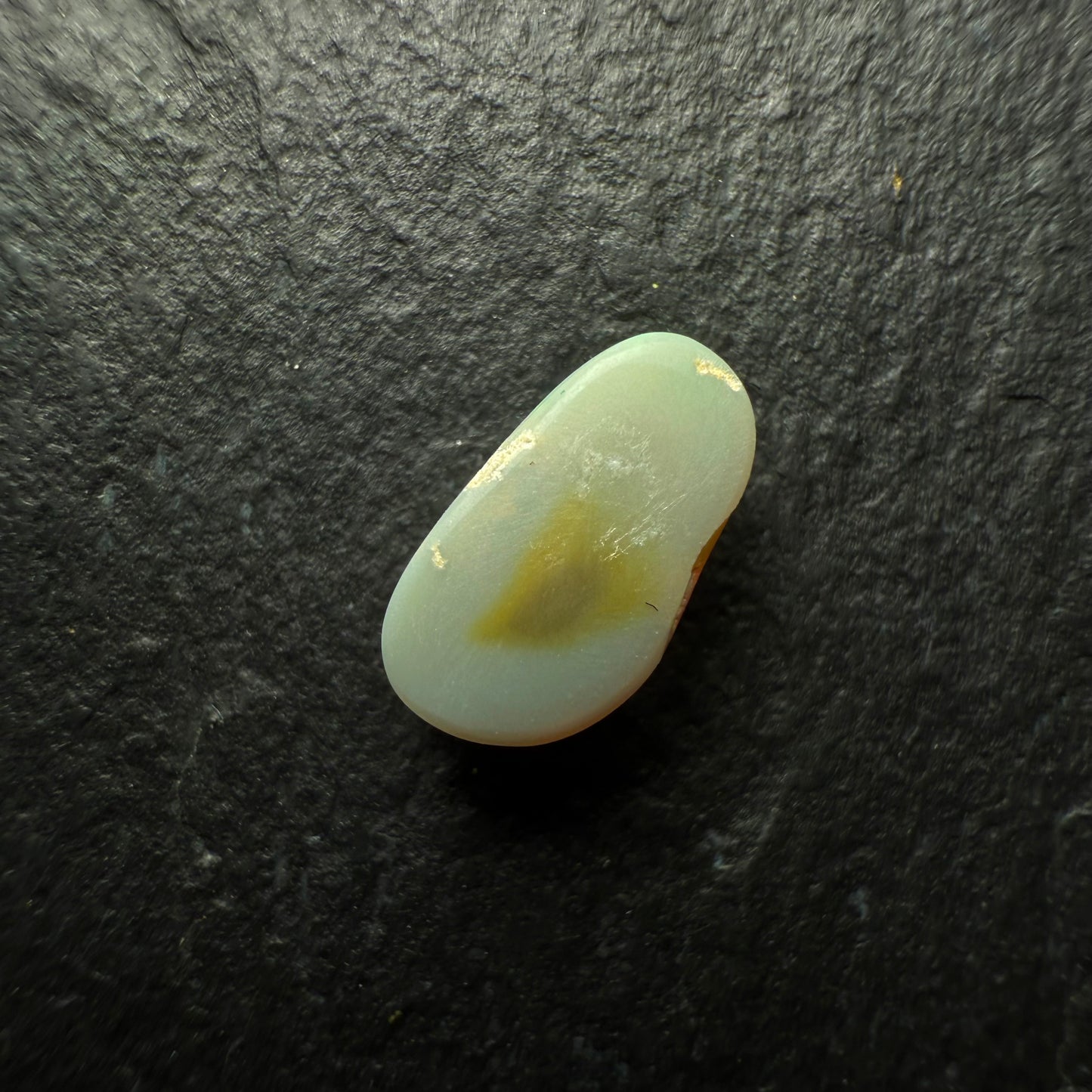 0.6ct Dark Opal With A Vivid Green-Gold Broadflash Pattern