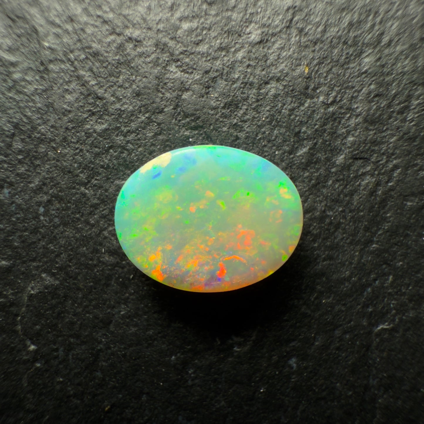 0.7ct Crystal Opal This Gem Has A Lovely mix Of Colors And Depth