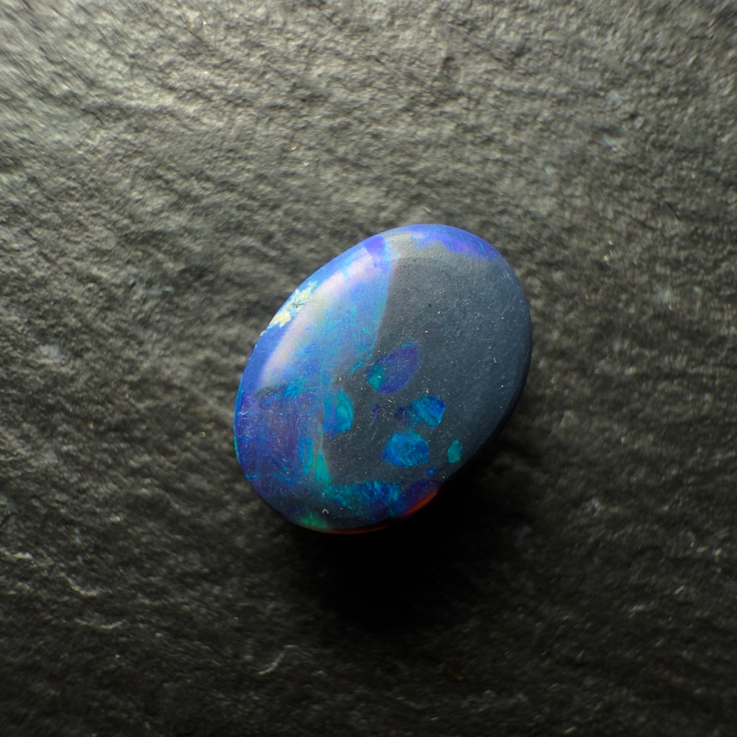 0.88ct Black Opal, This Gem Has A Dark Blue-Green Color Palette With A Mossy Pattern