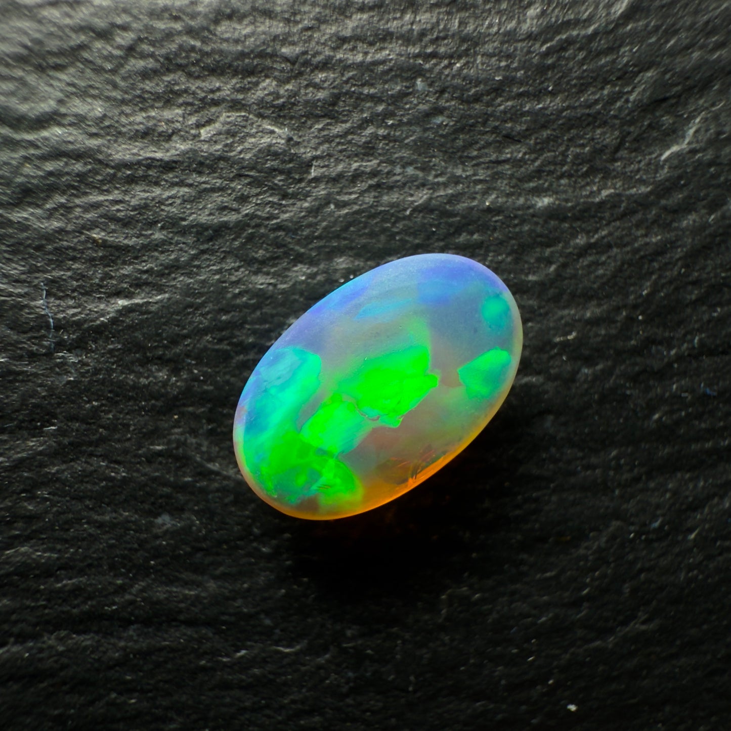 0.96ct Dark Crystal Opal, This Gem Has Bright Greens, Golds and Hints Of Blue