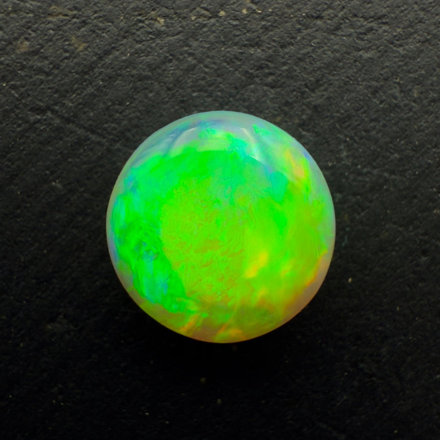 1.1ct Dark Crystal Opal With A Vivid Green Gold Color Palette And Lots Of Depth