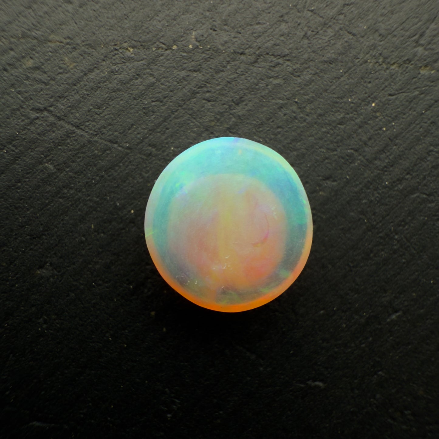 1.1ct Dark Crystal Opal With A Vivid Green Gold Color Palette And Lots Of Depth