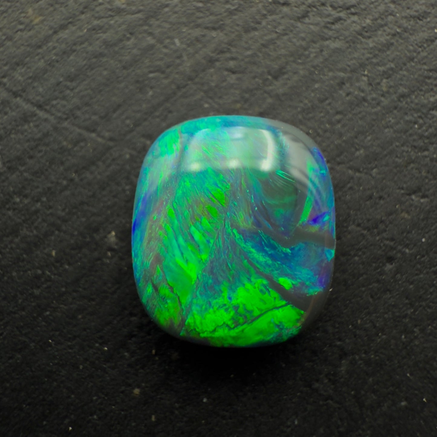 0.78ct Affordable Cushion Cut Black Opal With Rich Blues And Greens