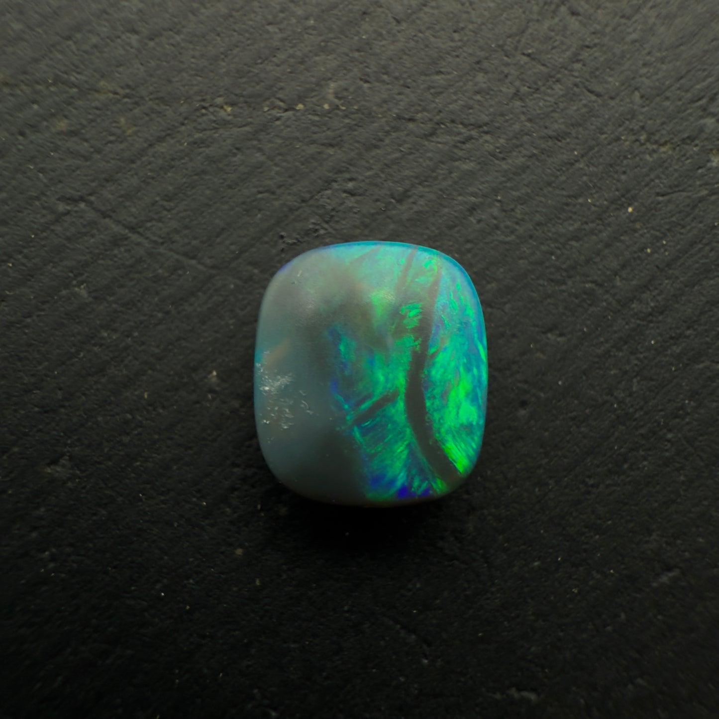 0.78ct Affordable Cushion Cut Black Opal With Rich Blues And Greens