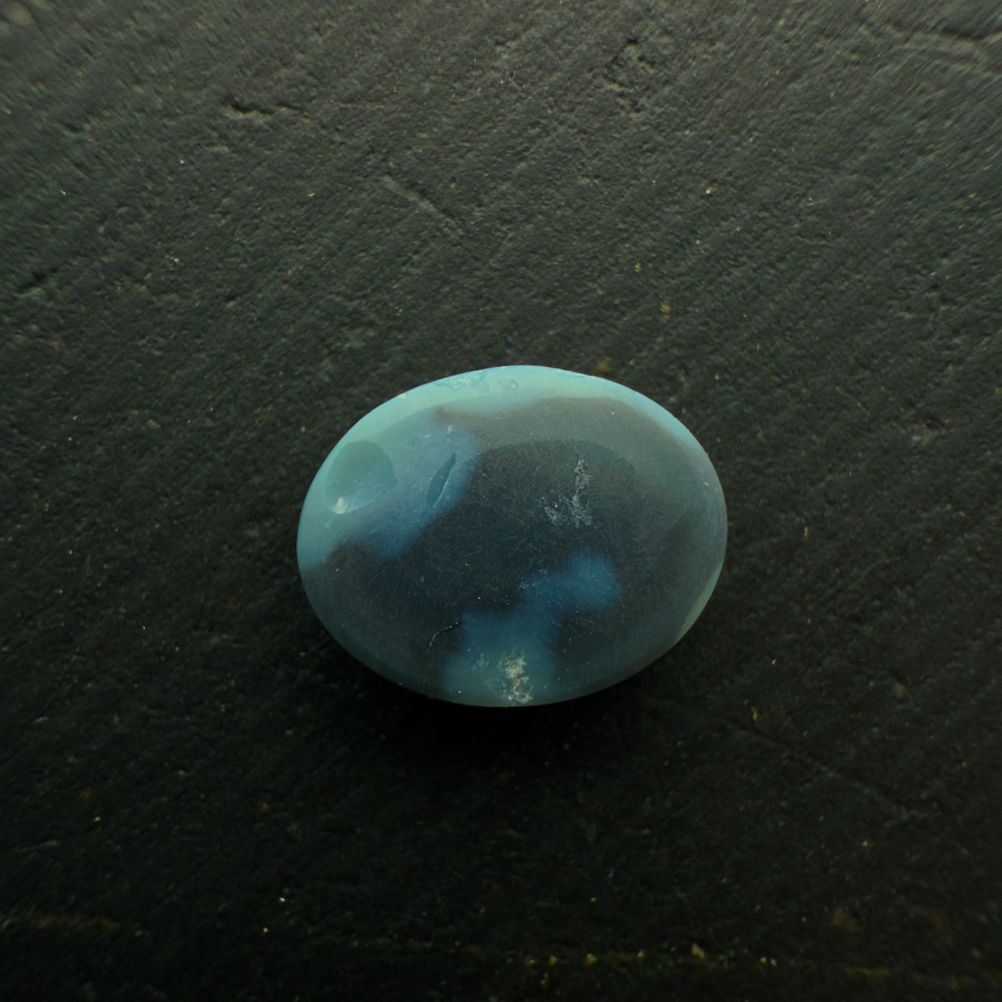 0.63 Black Opal With A Vivid Green-Orange Color Palette And Rare Ribbon Pattern