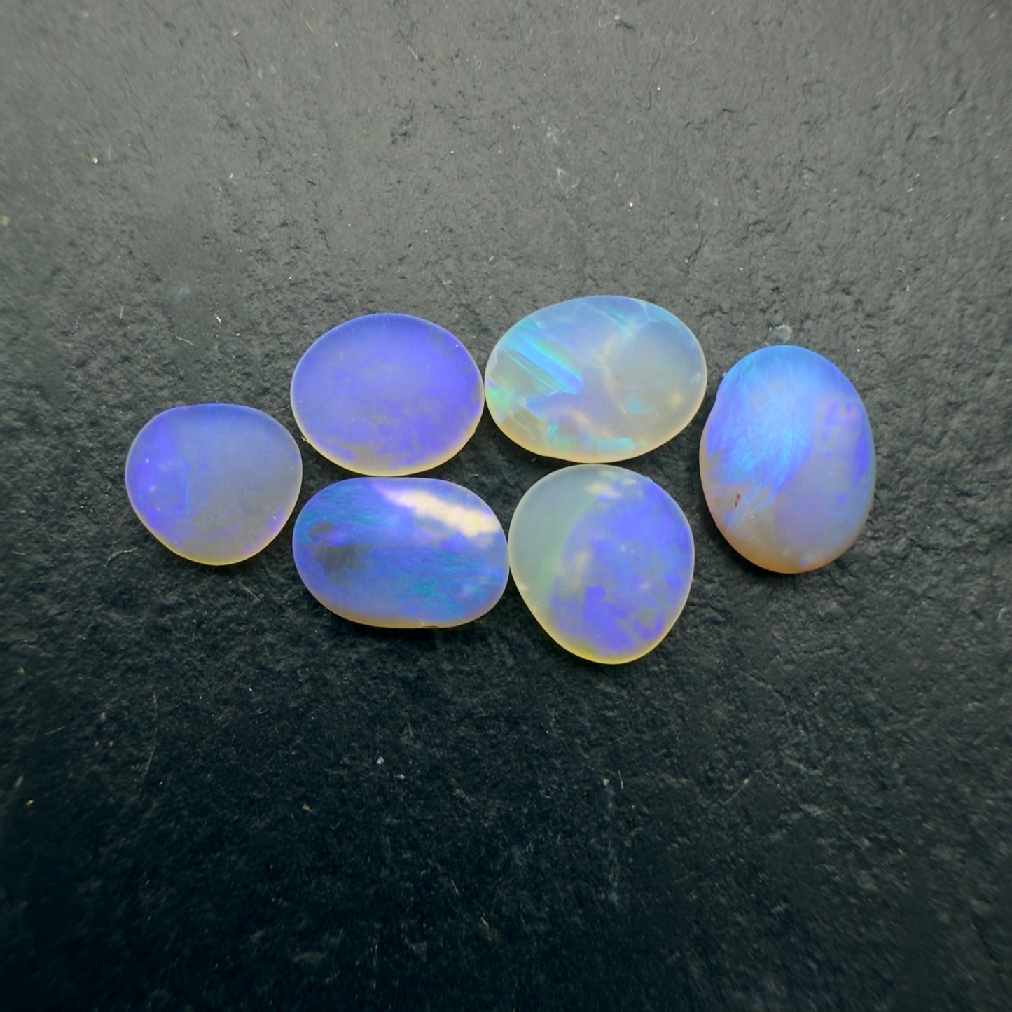 2.45ct Bundle (Price For Parcel) Matte finished opals with a soft purple glow