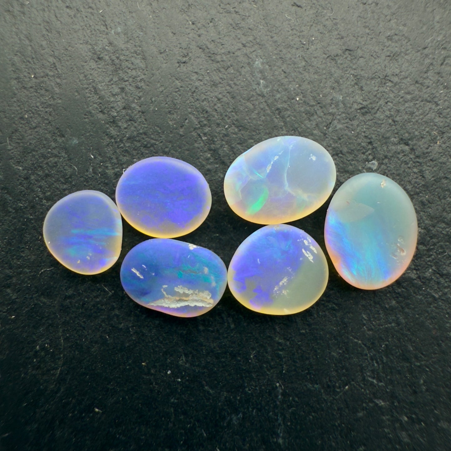 2.45ct Bundle (Price For Parcel) Matte finished opals with a soft purple glow