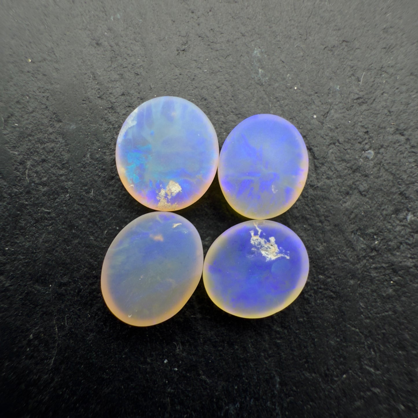 2.2ct Bundle (Price For Parcel) Matte finished opals with a soft purple-green glow