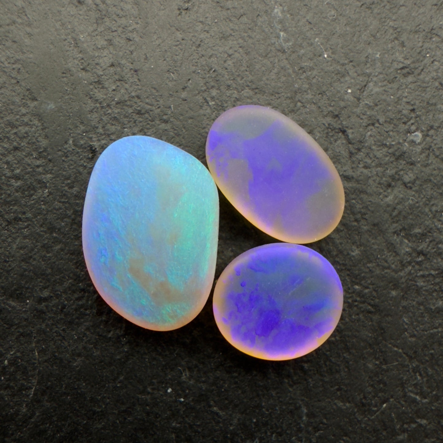 2.2ct Bundle (Price For Parcel) Matte finished opals with a soft purple-green glow