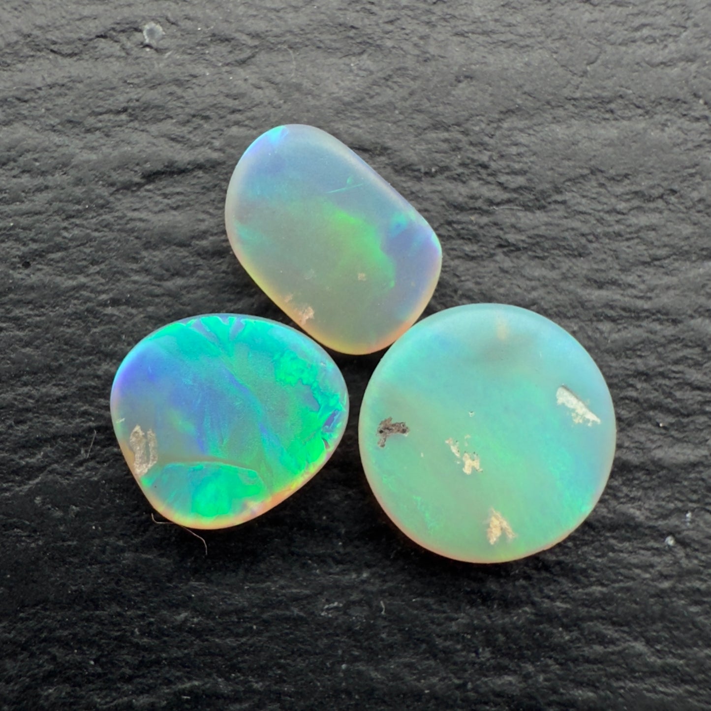 1.1ct Bundle (Price For Parcel) Matte finished opals with a soft purple-green glow