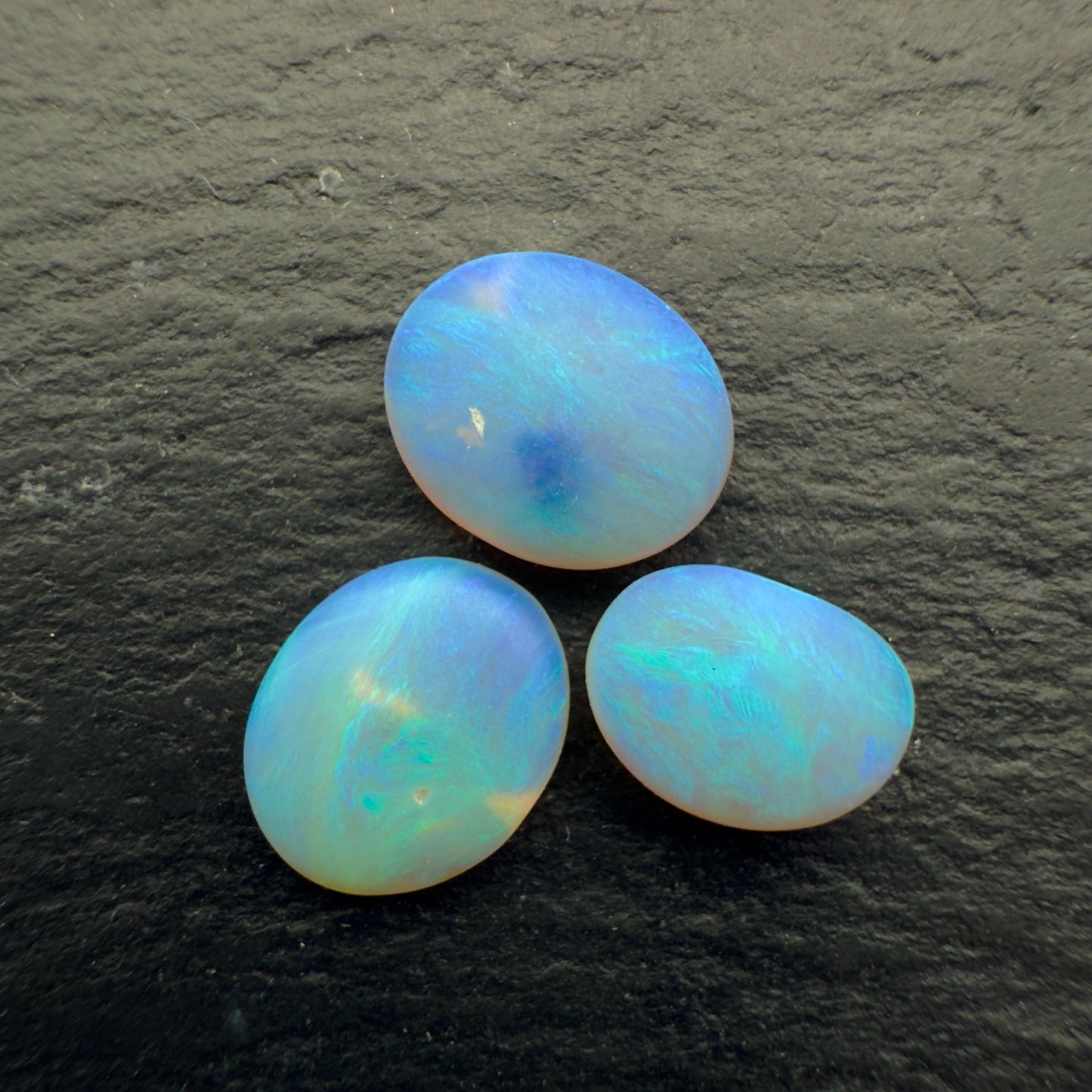 2.2ct Bundle (Price For Parcel) Matte finished opals with a soft purple-green glow