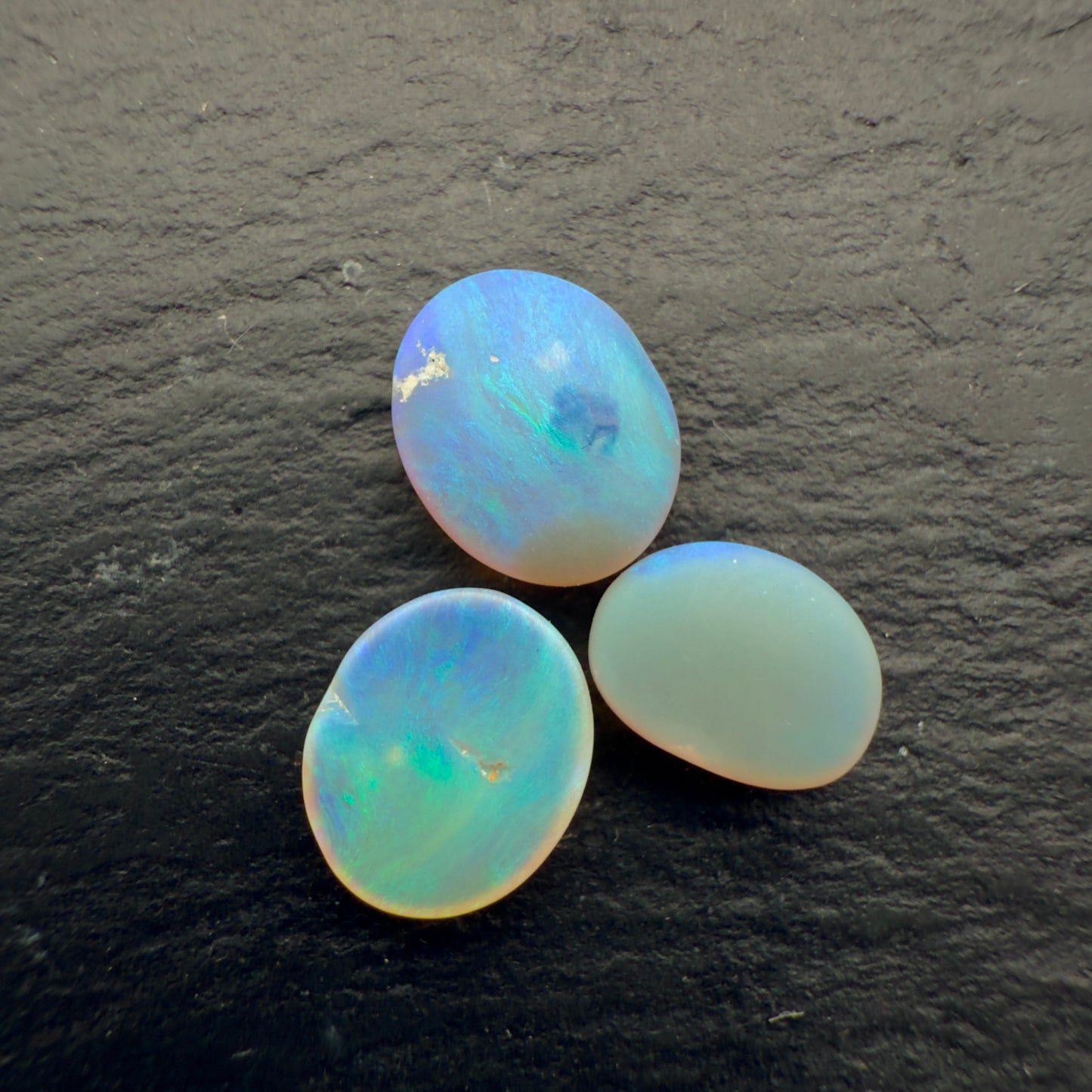 2.2ct Bundle (Price For Parcel) Matte finished opals with a soft purple-green glow