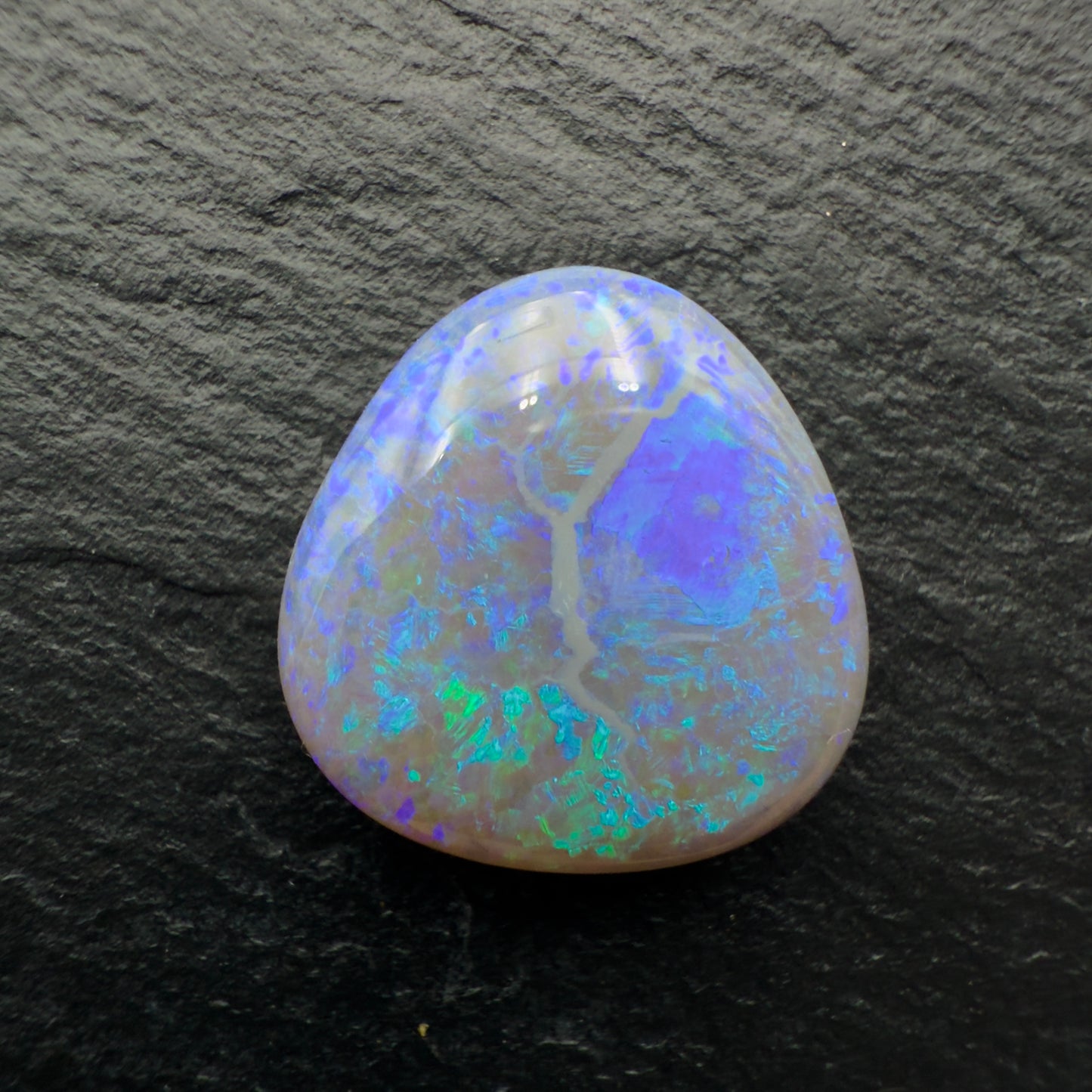 9.4ct Dark opal with a Freckled Blue Green Pattern