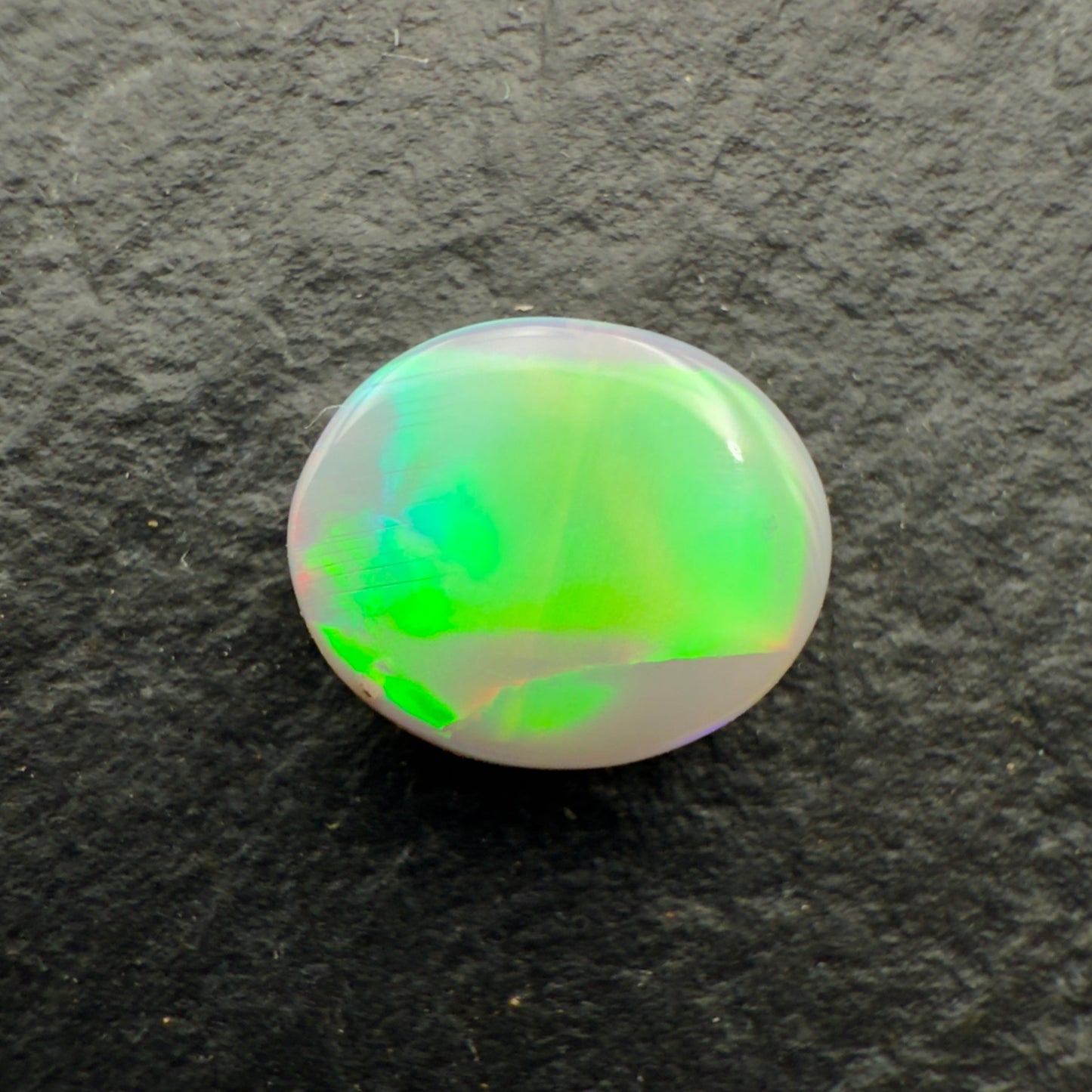 1.0ct Affordable Dark Opal With Neon Green Broadflash Pattern