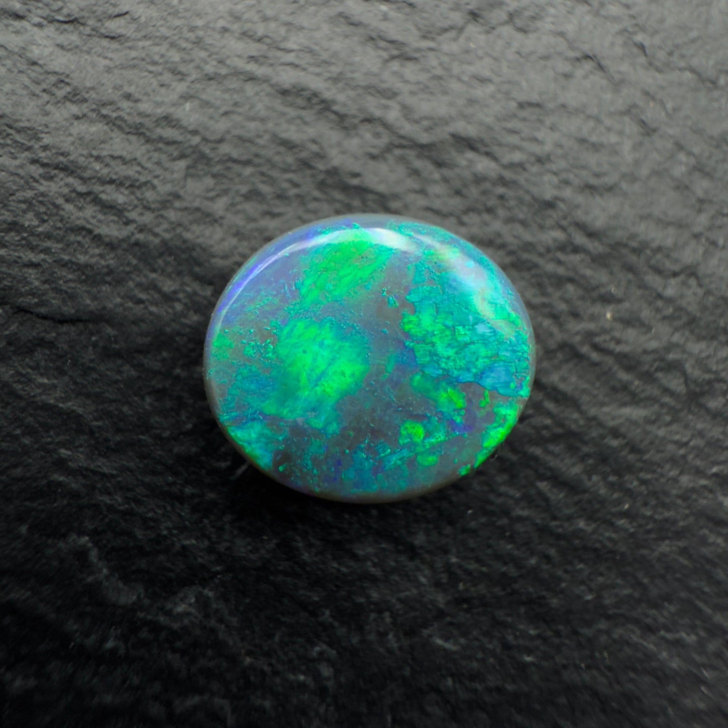 1.6ct Gem Black opal with a unique pattern and minty green color palette
