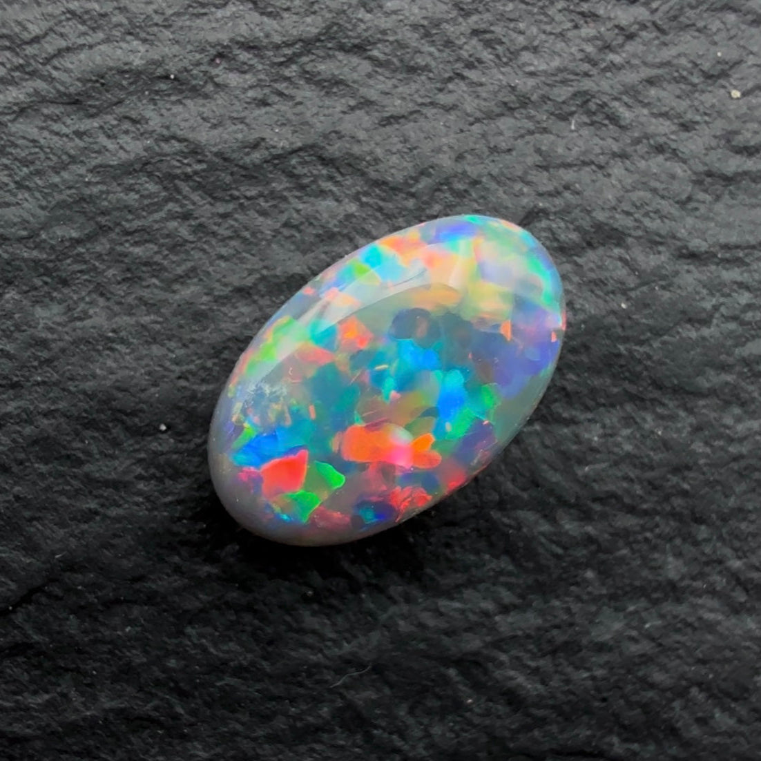 0.49ct Top Gem Black Opal With Rare Red-Blue floral Pattern