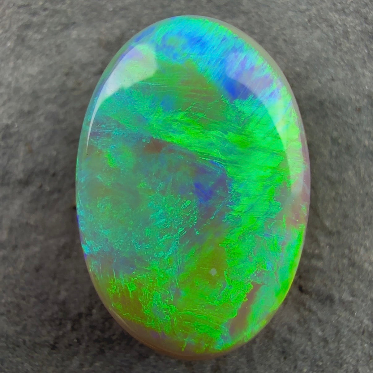 3.2ct Dark Opal With A Vivid Green Mossy Broadflash Pattern