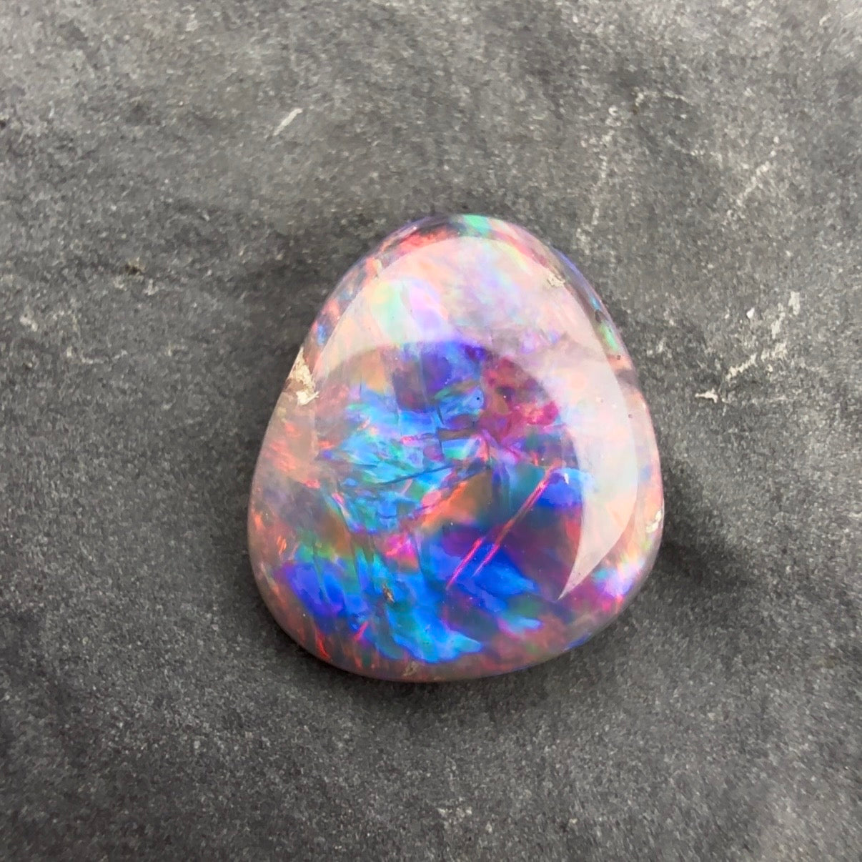 0.57cts Affordable Dark Opal With A Red Pink Multicolor Palette