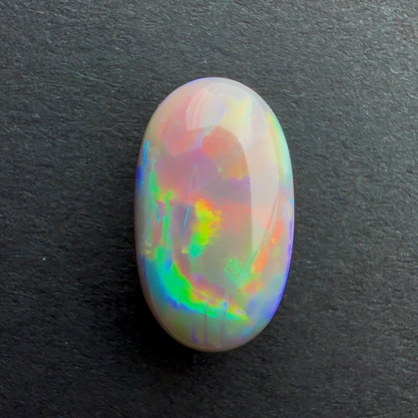 3.55cts Dark Opal With A Red Pink Multicolor Play Of Color, From Lightning Ridge Australia