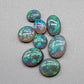 Assorted crystal and Dark Opals with bright blue green color and high quality patterns and color dispersal