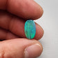 3.0ct teal colored black opal with a striated moss pattern