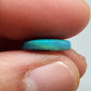 3.0ct teal colored black opal with a striated moss pattern