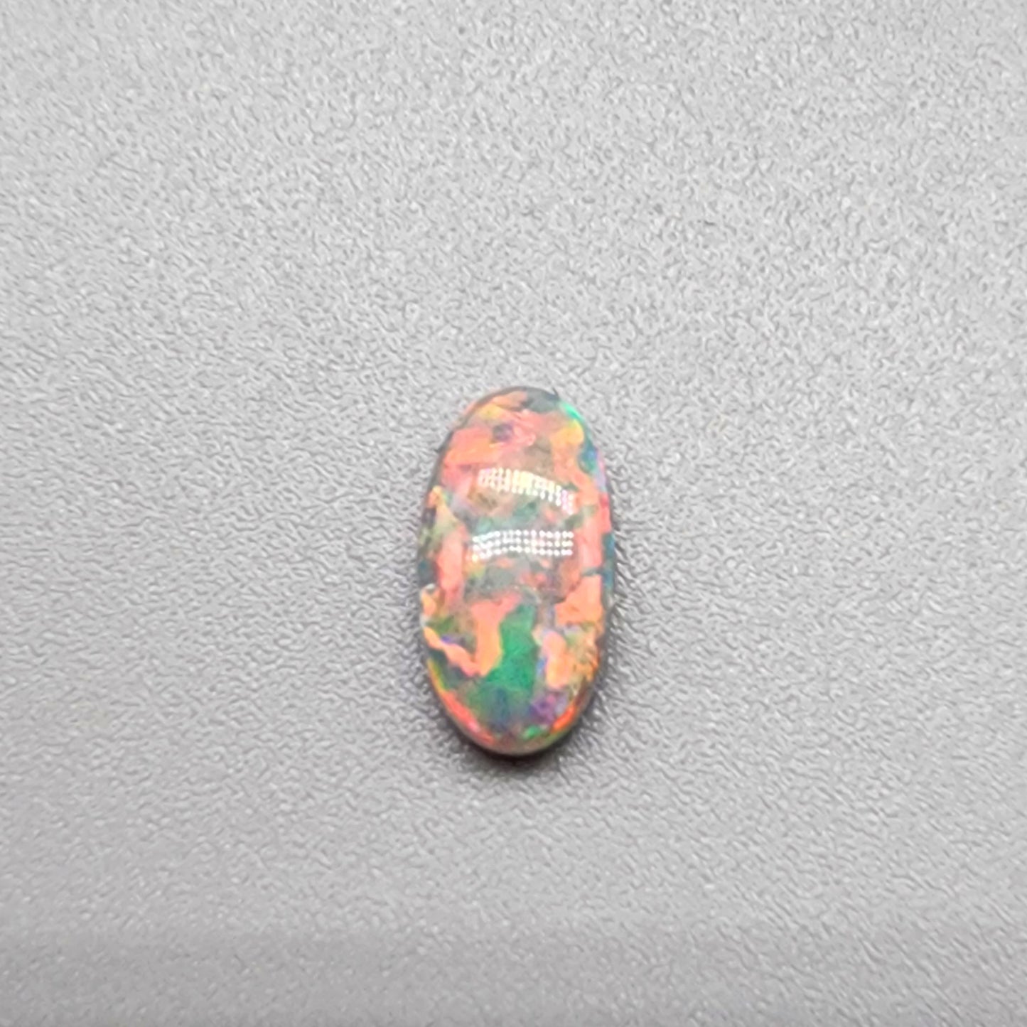 .80cts Dark Opal with vivid pink and orange color play and green undertones