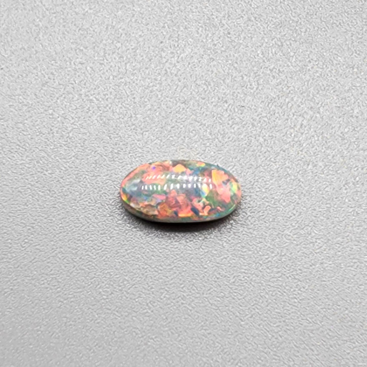 .80cts Dark Opal with vivid pink and orange color play and green undertones