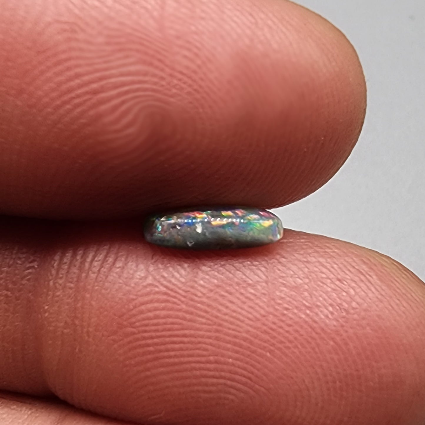 .80cts Dark Opal with vivid pink and orange color play and green undertones