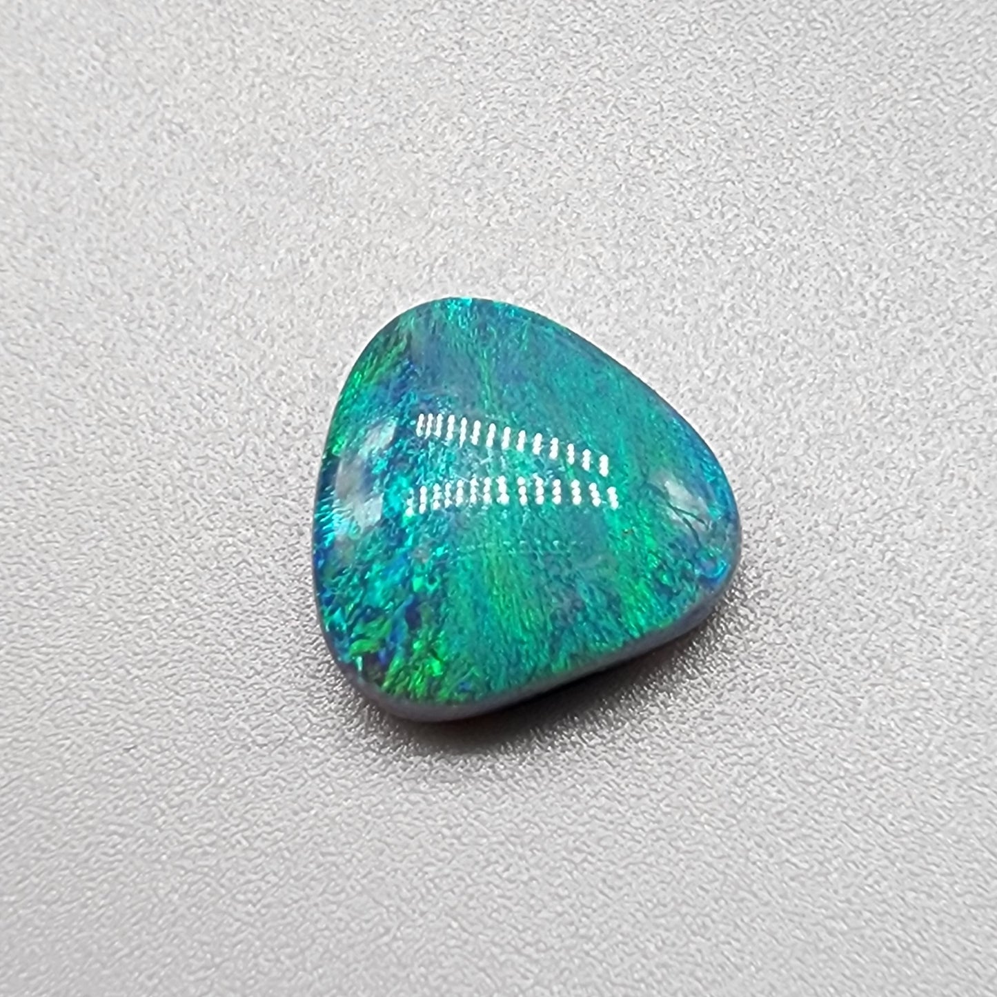 3.6cts teal pallet Black opal with a striated moss pattern