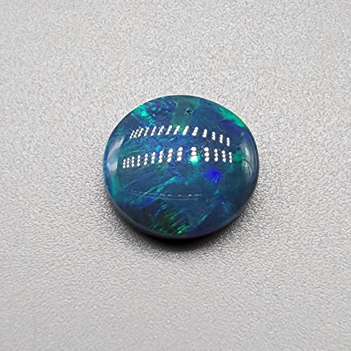 2.6ct Black Opal with blue green mixed patterns