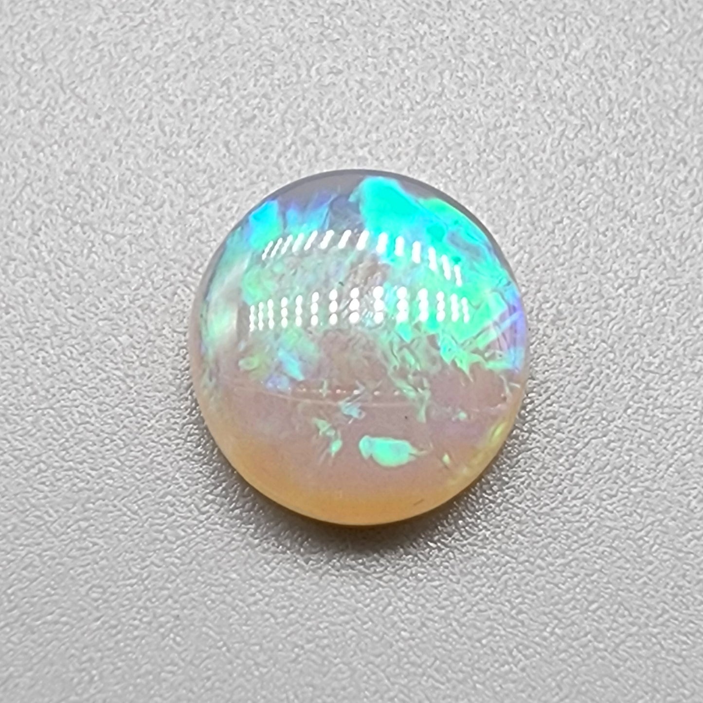 2.8ct Crystal Opal with minty green patterning and hints of blue