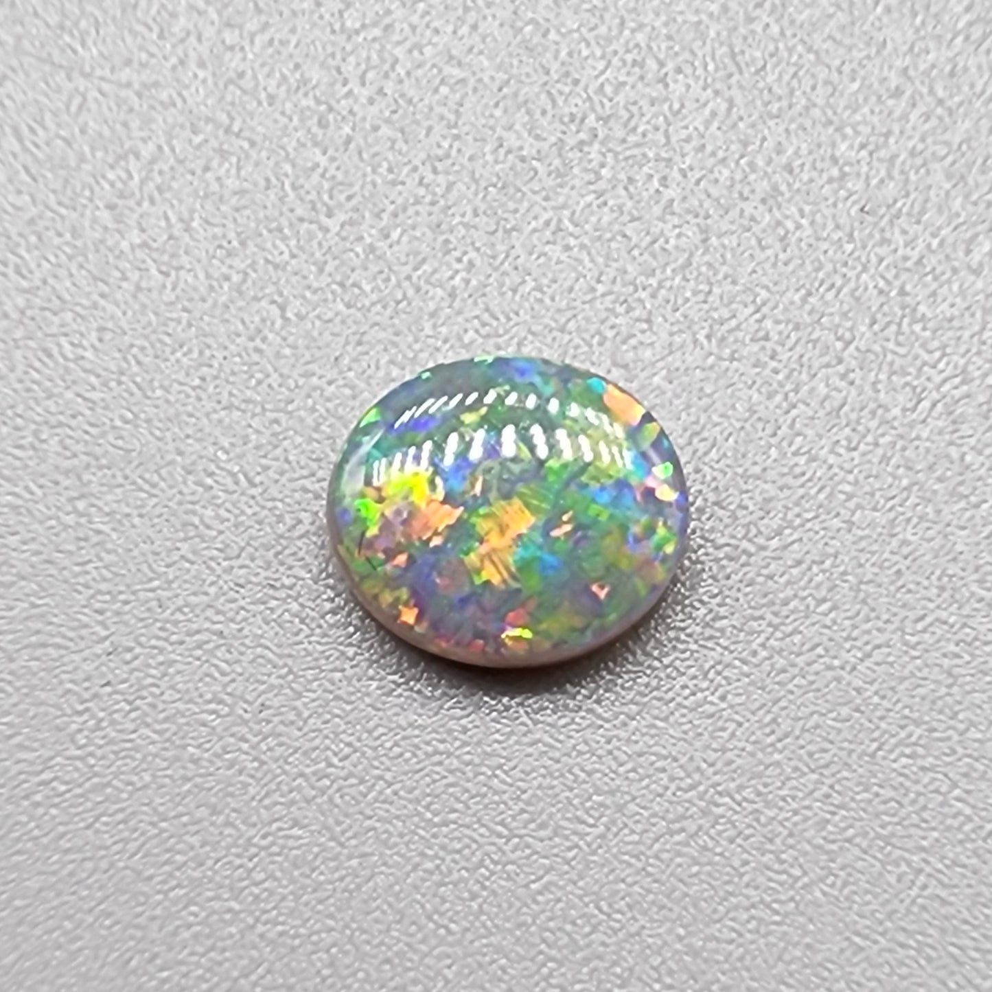 0.80ct Black Opal with multi colored floral pattern