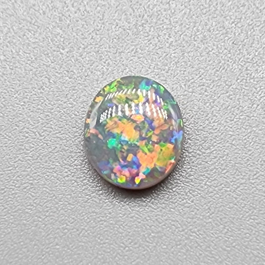 0.80ct Black Opal with multi colored floral pattern