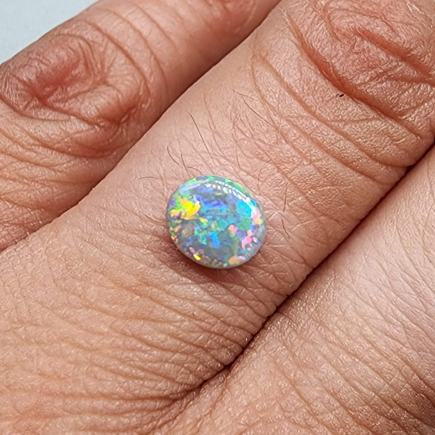 0.80ct Black Opal with multi colored floral pattern