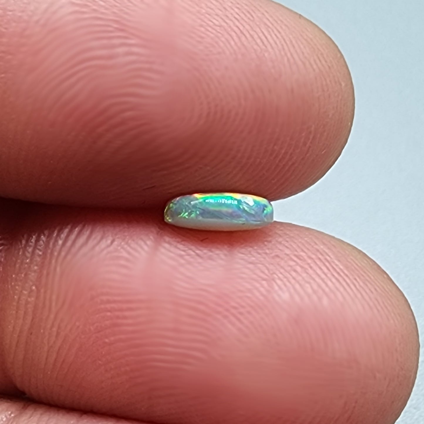 0.65ct Dark Opal with a multicolor pallet