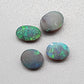 Assorted black opals with vivid greens, golds and blues