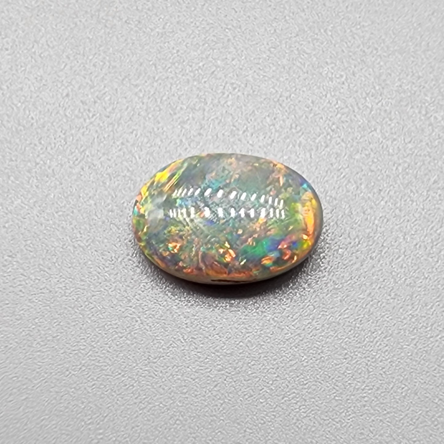 4cts Black Opal with a warm color pallet an mixed patterns