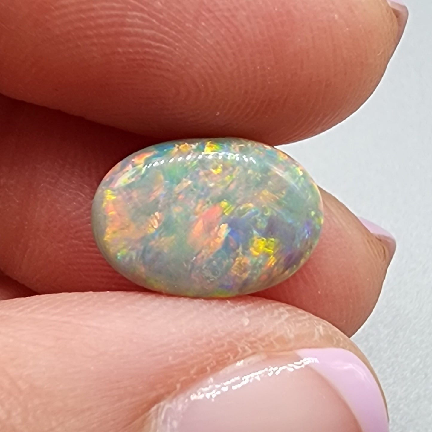 4cts Black Opal with a warm color pallet an mixed patterns